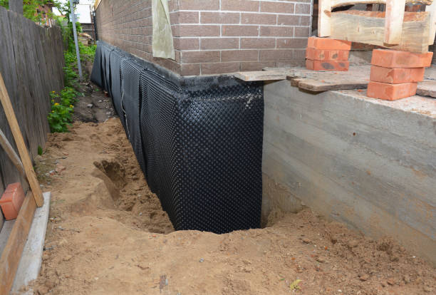 Happy homeowners after waterproofing job in New Baltimore